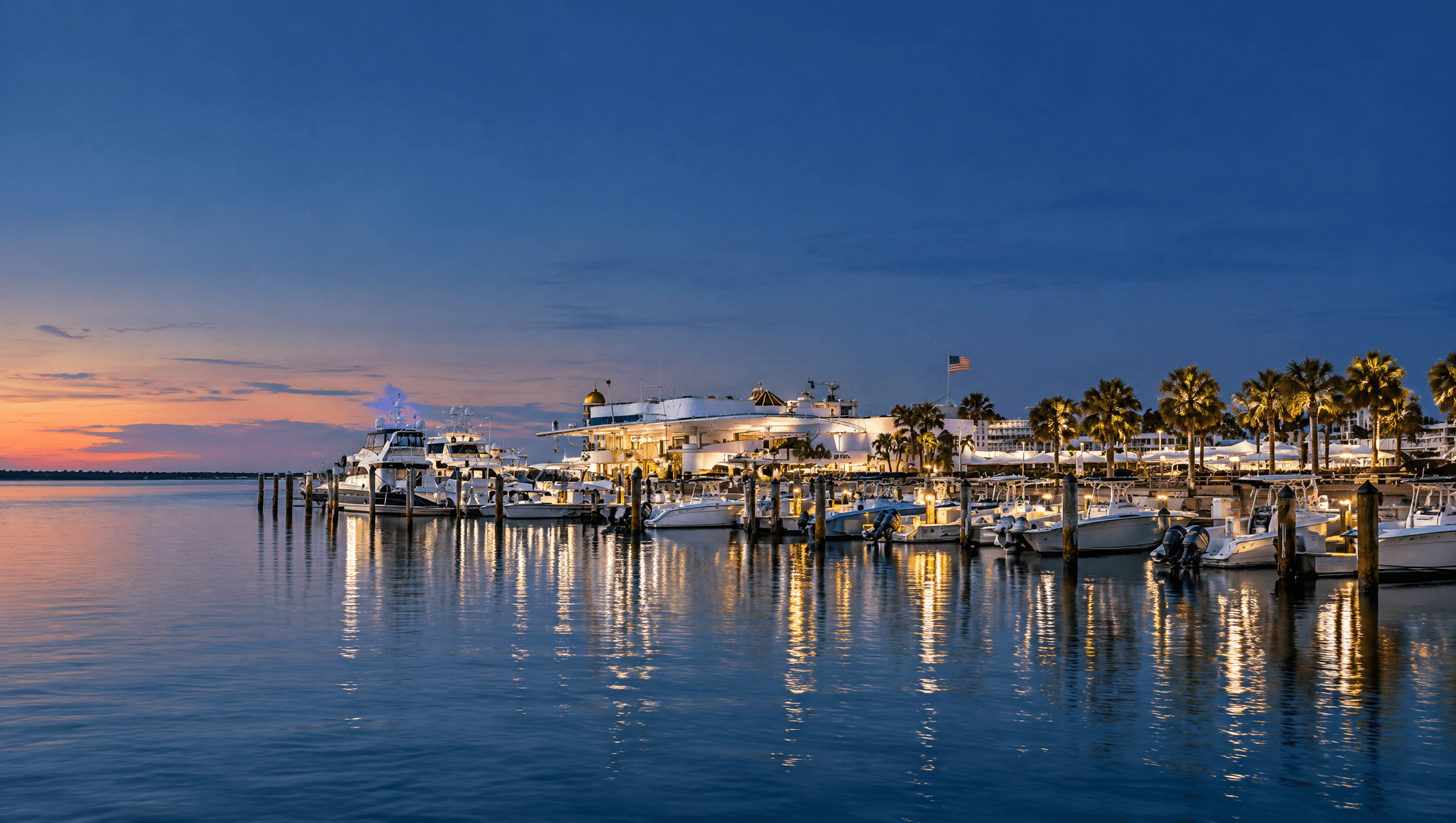 Photo illustration of Sarasota's Marina Jack waterfront at dusk.